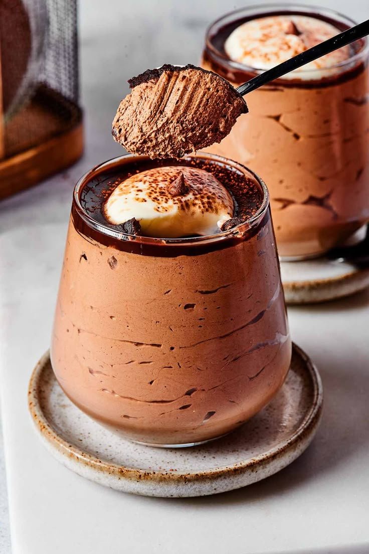 Creamy coffee mousse set with agar agar, topped with whipped cream